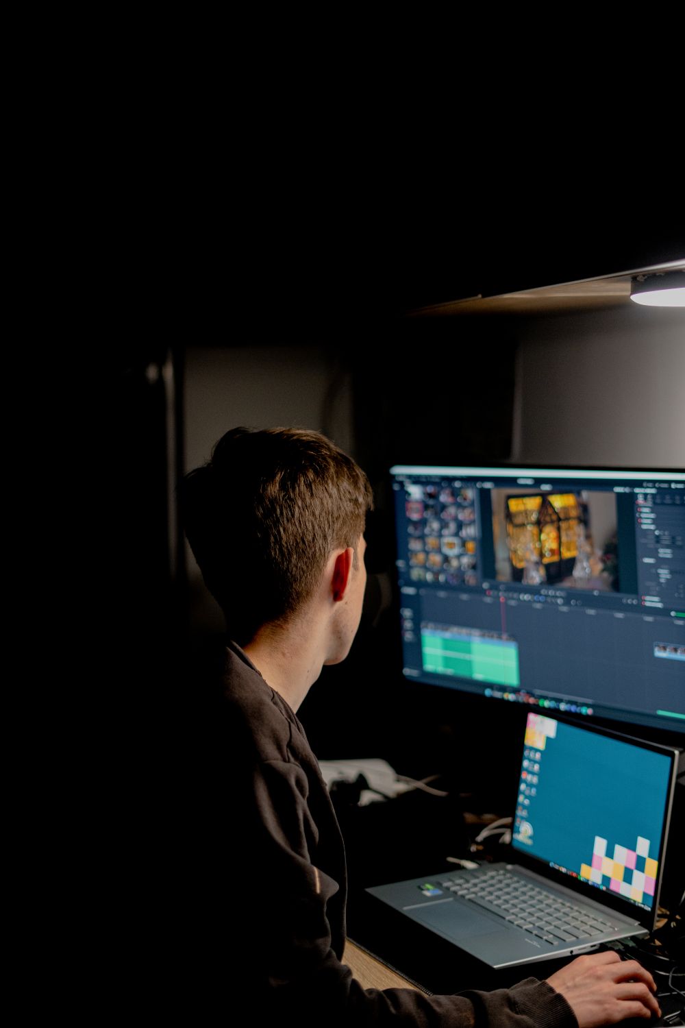 A video editor working on a timeline at a monitor