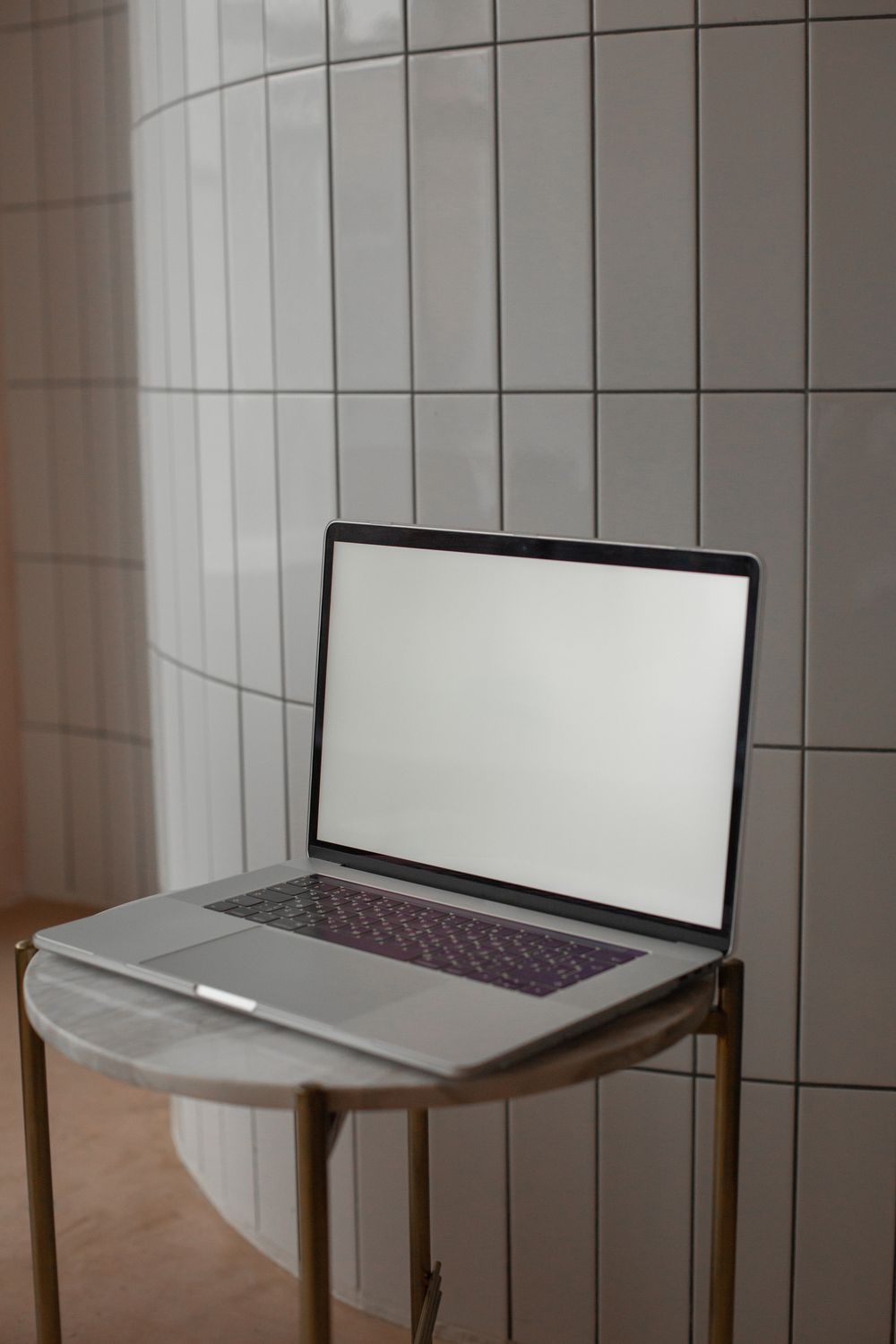 An open laptop with a blank screen on a desk
